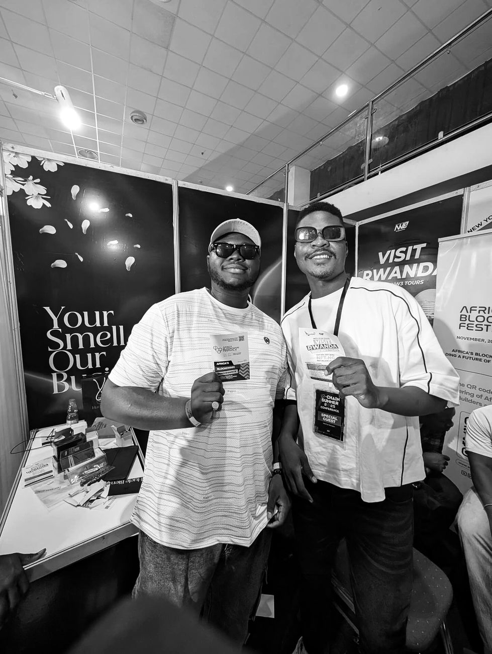 Harold and a friend holding event passes at NFT.ng